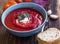 Creamy cold soup with beetroot and tomatoes, rustic cream vegetables soup in a bowl