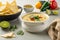 Creamy and flavorful vegan queso dip, made with all-natural ingredients, on a white table