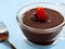 Creamy Indulgence: Irresistible Chocolate Pudding on a Scrumptious Table Spread