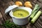 Creamy leek soup on wooden background