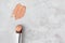 Creamy liquid foundation smear and makeup brush on luxury marble background, top view. Swatch of professional cosmetic cover