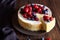 Creamy mascarpone cheese cake with strawberry and winter berries. Christmas New York Cheesecake. Healthy food ration .