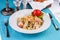 Creamy pasta with shrimps, crab meat, seafood, squid rings, tomatoes, basil, greens and cheese.