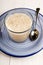 Creamy porridge in a glass on plate