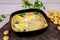 Creamy seafood soup with egg and crackers