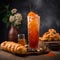 Creamy and sweet Thai Iced Tea with sweet pastries on a table