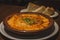 Creamy Tokyo Style Lasagna served in a brown china bowl with bread