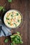 Creamy Tortellini pasta soup with spinach, celery, carrot and chicken broth