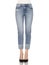 Crease & Clips Slim Women`s Light Blue Jeans, Woman in Blue tight jeans with white heels, white background