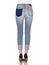 Crease & Clips Slim Women`s Light Blue Jeans, Woman in Blue tight jeans with white heels, white background