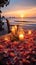 Create cherished memories with a beachside dinner, candles, flowers, and sunset