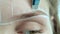 Create permanent eyebrow makeup. Marking the shape of the eyebrows.