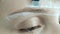 Create permanent eyebrow makeup. Marking the shape of the eyebrows.