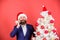 Create santa call this christmas. Man bearded wear suit and santa hat hold phone. Manager congratulate colleagues mobile