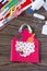 Creates a baby gift from a paper apron postcard for grandmother on mother`s day. Hand-made.