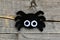 Creating a felt Halloween spider ornament. Step. Cute Halloween spider ornament isolated on a vintage wooden background