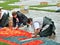 Creating Flower Carpet on Grand Place during rain