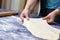 Creating homemade Phyllo or strudel dough on a home table cloth