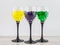 Creating an intimate  atmosphere, room decoration: three glasses filled with hydrogel balls of different colors