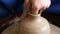 Creating jar or vase of clay. Woman hands, potter`s wheel