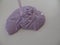 Creating patterns out of lilac coloured glossy slime