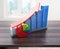 Creative abstract business success, financial growth and development concept: color growing bar charts with red rising arrow