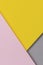 Creative abstract yellow, pink and gray color geometric paper compositon background, top view