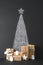 Creative Alternative Christmas tree. Christmas background with chalkboard and presents.