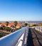 Creative angle from white metal railings on the bridge of Nelson Mandela Boulevard.