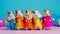 Creative animal concept. Hamsters in a group vibrant in brightly colored capes and hats on colored background