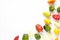 Creative arrangement of colorful bell peppers on white