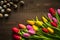 Creative arrangement of tulips and quail eggs on rustic wooden background for March 8, International Womens Day, Birthday ,