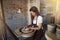 Creative artisan shaping clay on a wheel in her studio