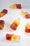 Creative atmosphere of sweet soft soda gummies on white background