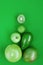 Creative background of green various summer tropical fruits. Food concept for fitness dinner,plant based diet,frutarian