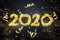 Creative background, numbers 2020 consisting of brush strokes of gold paint on a close background. Happy new year, year of the rat