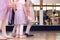 Creative Ballet Close Up little girls in ballet slippers with one girl kicking foot out; mirror in background