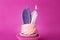 Creative birthday cupcake with burning candle on color background