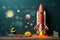 Creative blackboard childrens drawings and a charming toy rocket