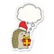 A creative cartoon hedgehog wearing christmas hat and thought bubble as a printed sticker