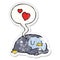 A creative cartoon penguin and love hearts and speech bubble distressed sticker