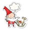 A creative cartoon santa making toy and thought bubble as a distressed worn sticker