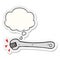 A creative cartoon spanner turning nut and thought bubble as a printed sticker