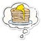 A creative cartoon stack of pancakes and thought bubble as a distressed worn sticker
