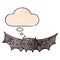 A creative cartoon vampire bat and thought bubble in grunge texture pattern style