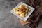 Creative cheese ravioli topped with fresh tomato and avocado and seasoning.