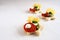 Creative christmas canapes in star shape with tomato, pesto and cheese, light background with copy space