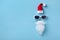 Creative Christmas composition. Greeting card, invitation or flyer. Santa Claus hipster with hat, beard and sunglasses.