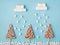 Creative Christmas minimal composition concept. Flatlay close up photo of three candy trees and fluffy marshmallow snowing