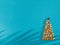 Creative Christmas tree made of seashells on modern blue paper background